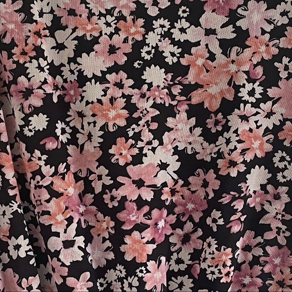 Pink flower print on black.